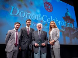 Mario Rodriguez, President Koppell, Josh Weston, and Samantha Barkho pose on stage
