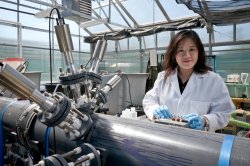 Meiyin Wu working on equipment in a lab.