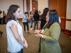 Jane Sanchez Swain speaking with a student