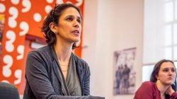 Female professor in classroom.