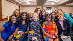 A group of nursing faculty members smiling