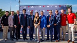 Group of attendees pose in Yogi Berra Stadium
