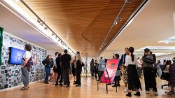 People standing in an art gallery space