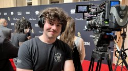 Aidan Ping, a junior Film and Television major, works on the 2024 Grammys' red carpet.