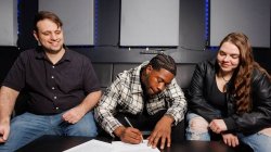 RNBHunter signing with Corey Morgart and Therese Sheridan.