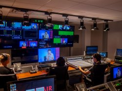 Three high school students watch television monitors, gaining hands-on experience at Montclair’s state-of-the-art School of Communication and Media.