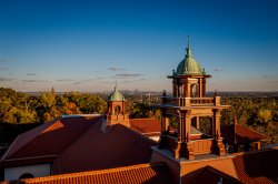 Aerial view of Cole Hall's roof during a sunset.