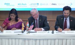 L to R: Secretary General Pankaj Mittal (AIU), Gov. Phil Murphy and President Koppel signing documents.