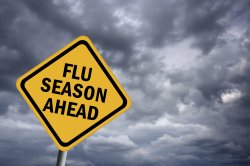 flu season ahead sign with clouds behind it