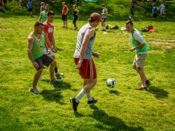 Photo of men playing soccer on campus.