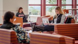 students sitting distanced in lounge
