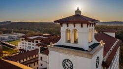 aerial photo of university hall at sunset