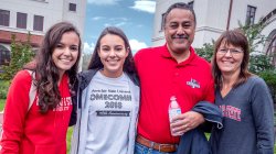 mother, father and two daughters in MSU apparel on campus