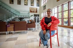 Student sitting in the red chair