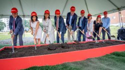 Montclair leaders digging shovels into ground at groundbreaking event.