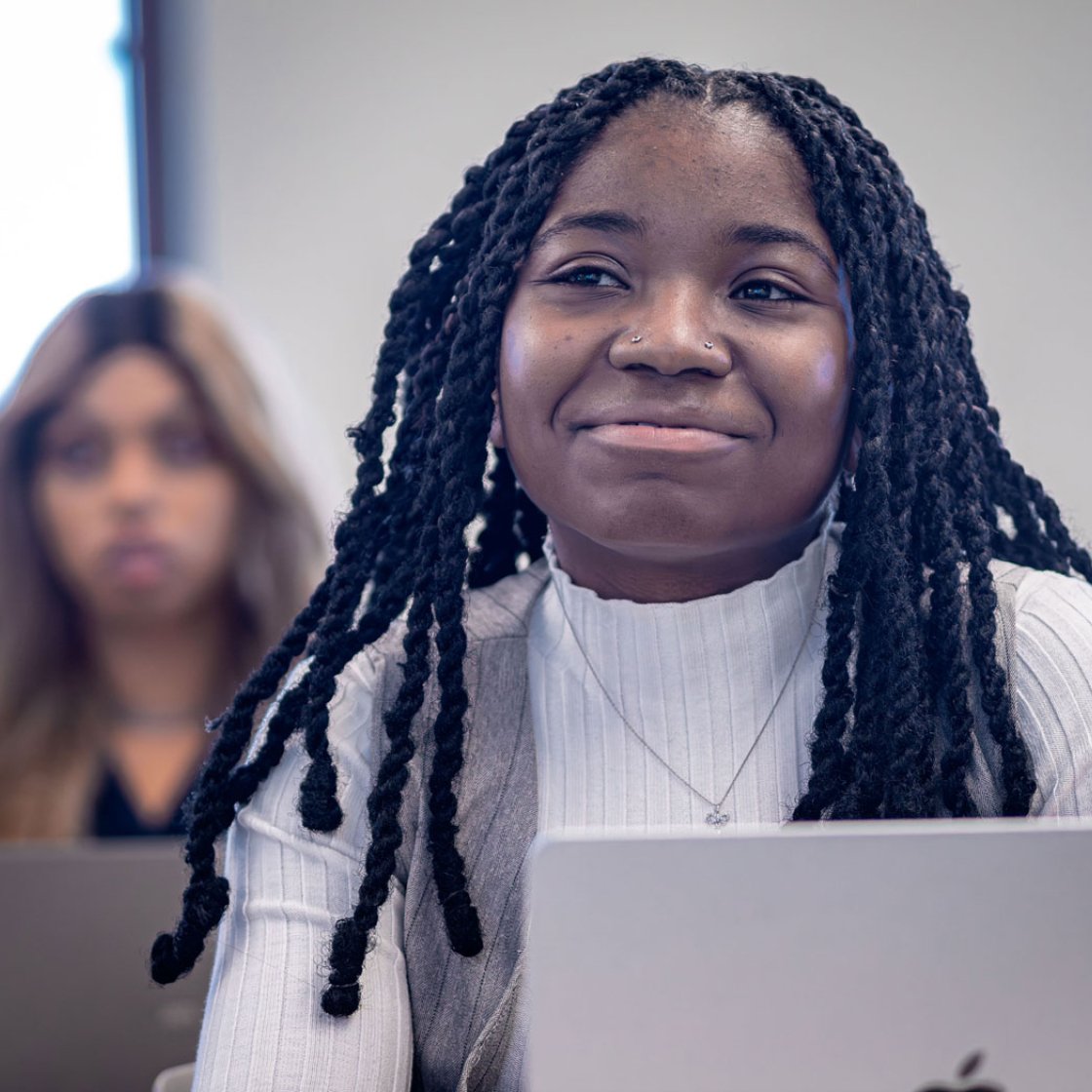 Adult female student in front of laptop.