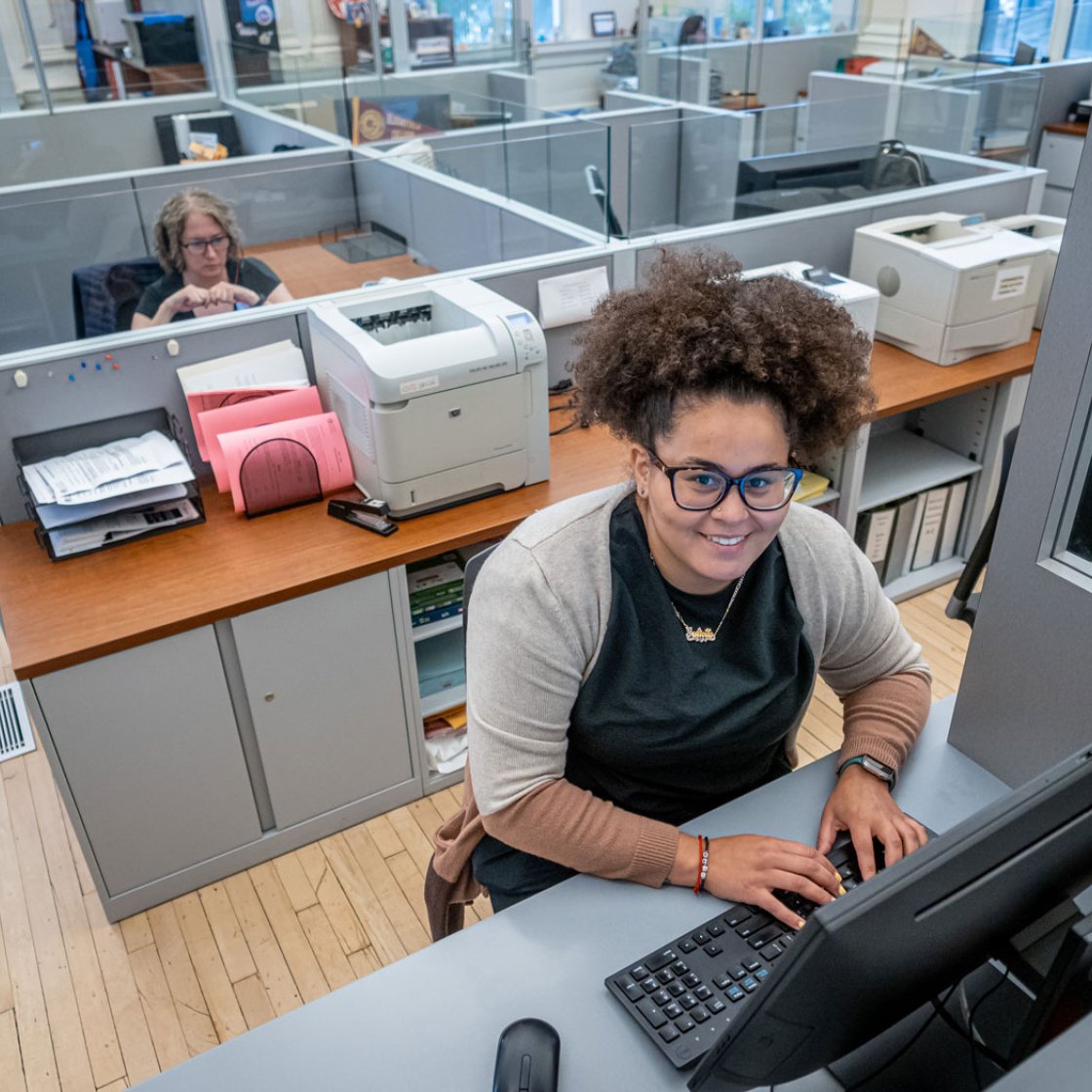 Woman at the front desk of student support center.