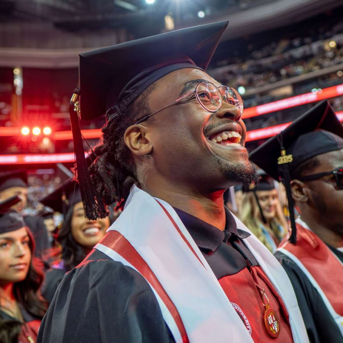 graduate smiling at commencement