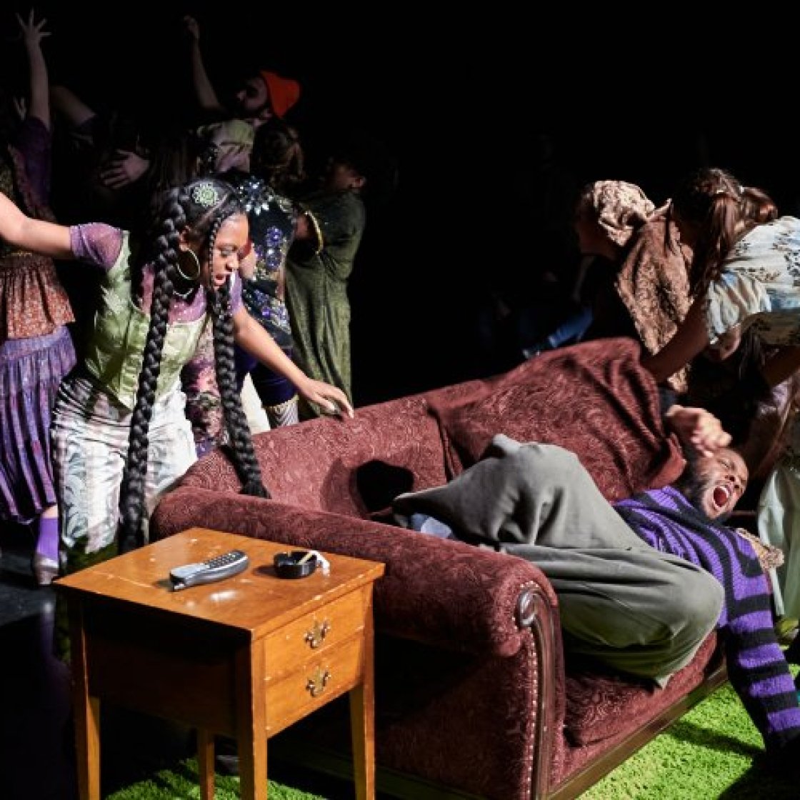 Actors on stage in costume.