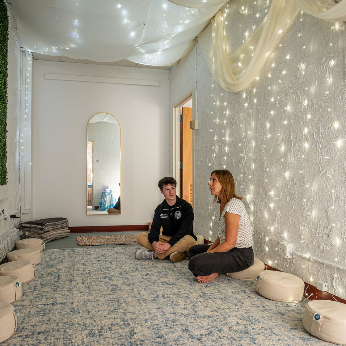 Donna Scro Samori, wellness coordinator for the Department of Theatre and Dance, and Artem Beliaviski relax together in the peaceful Zen Den space.
