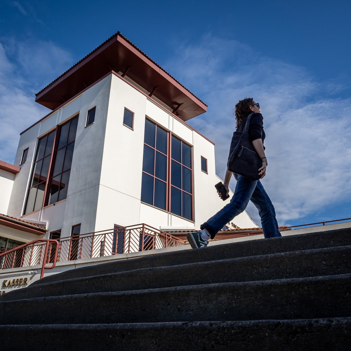 A student walks up steps on the Montclair campus.