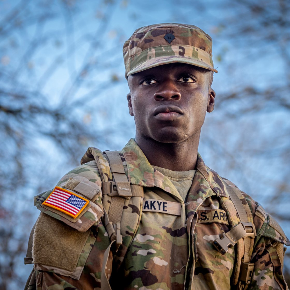  U.S. Army soldier in camouflage uniform and cap.