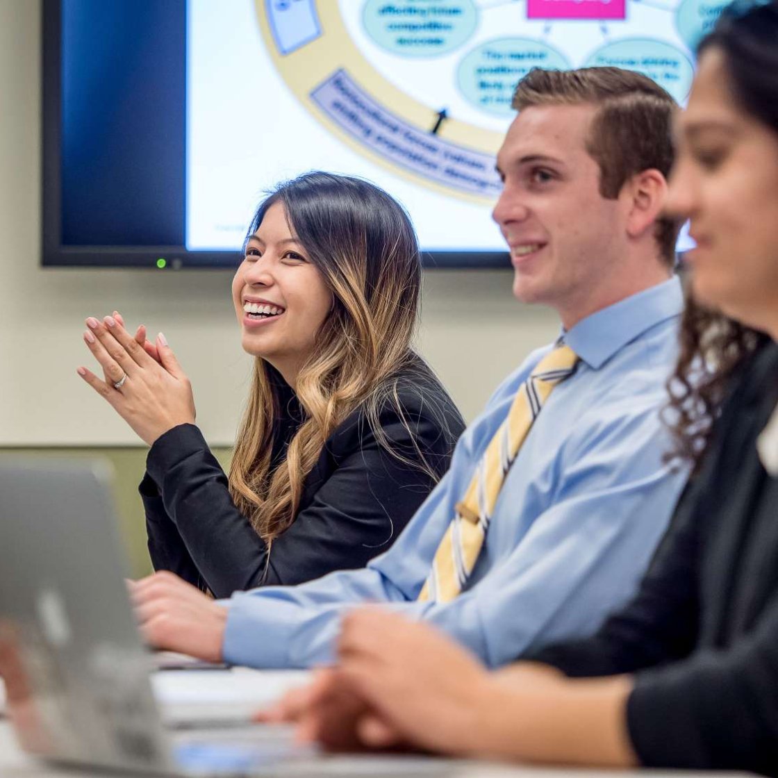 Students smiling in class.