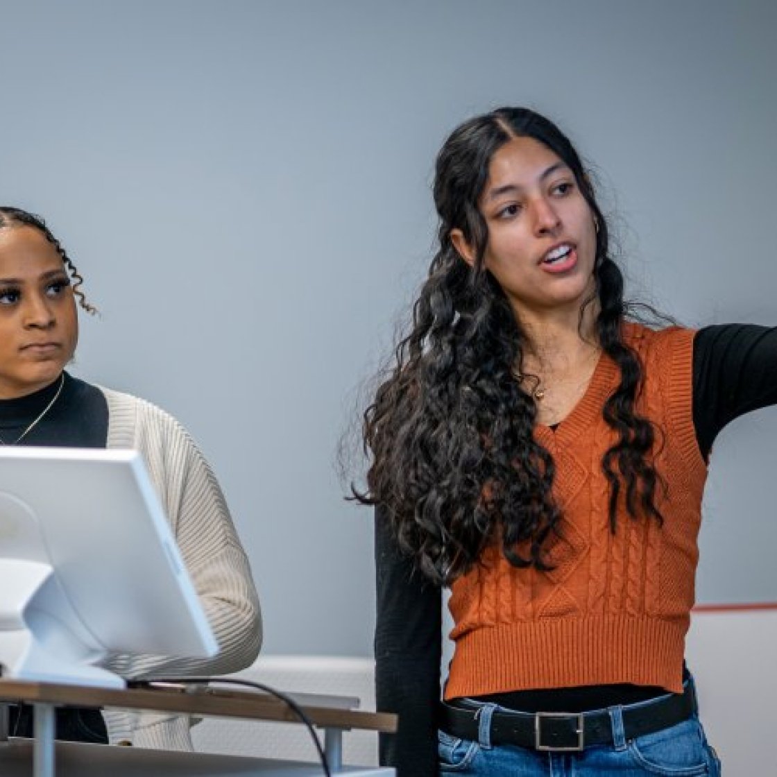 two students presenting in class