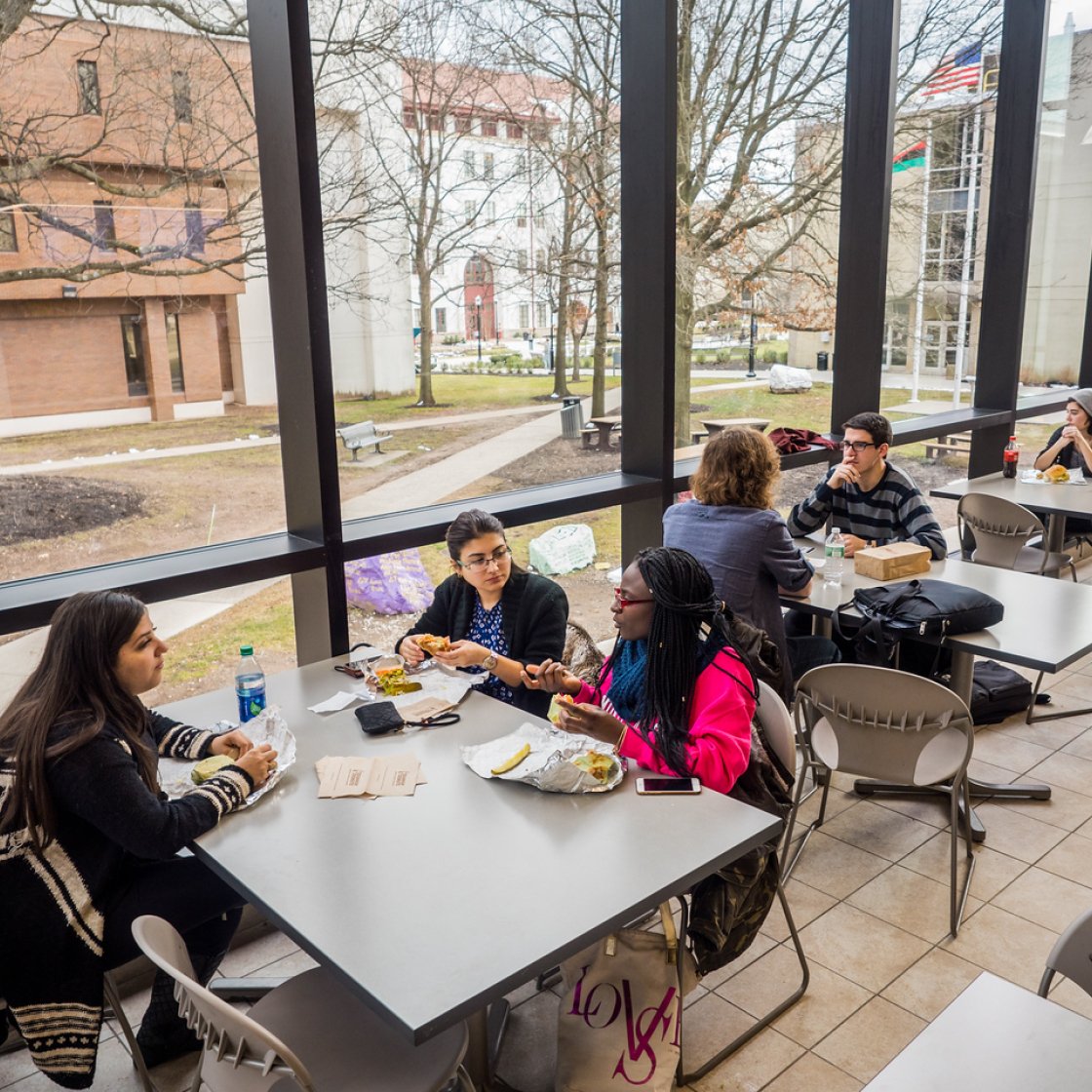 Students at a table at the cafeteria.