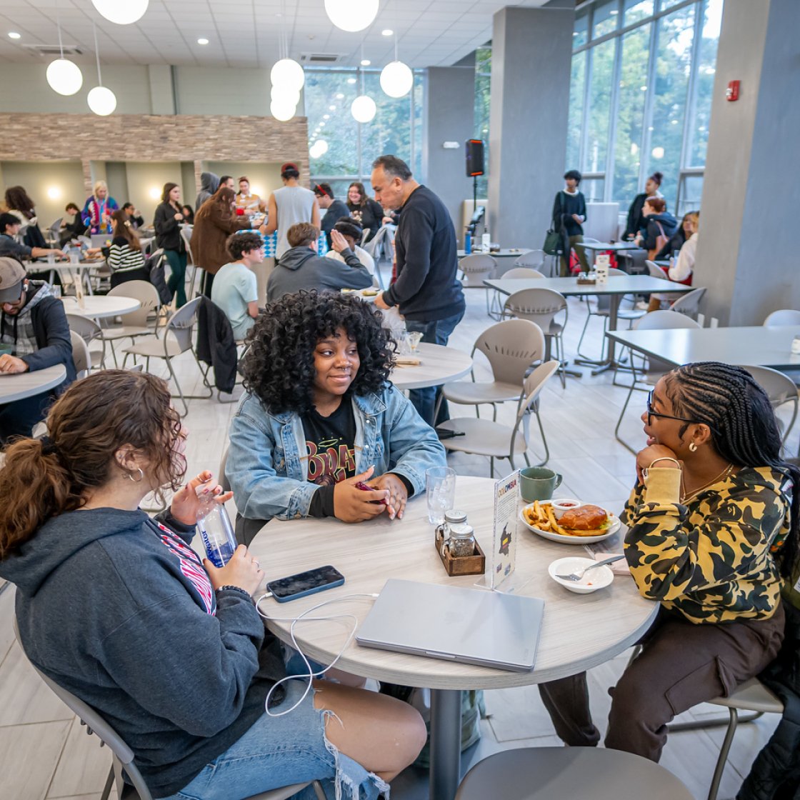 Students sat at a table conversating at Freeman Dining Hall.