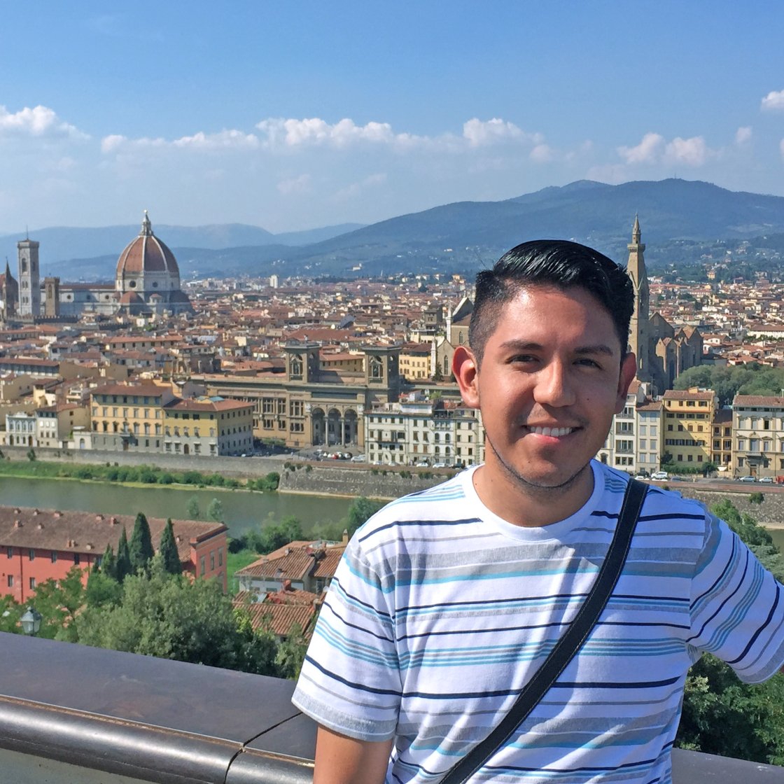 Oscar Guevara Perez with the skyline of Florence, Italy, in the background.