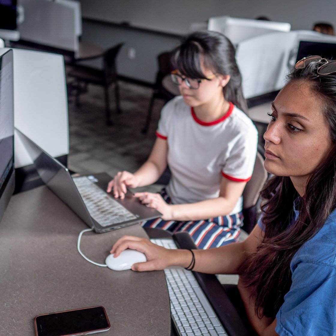 Students collaborating in a lab setting.