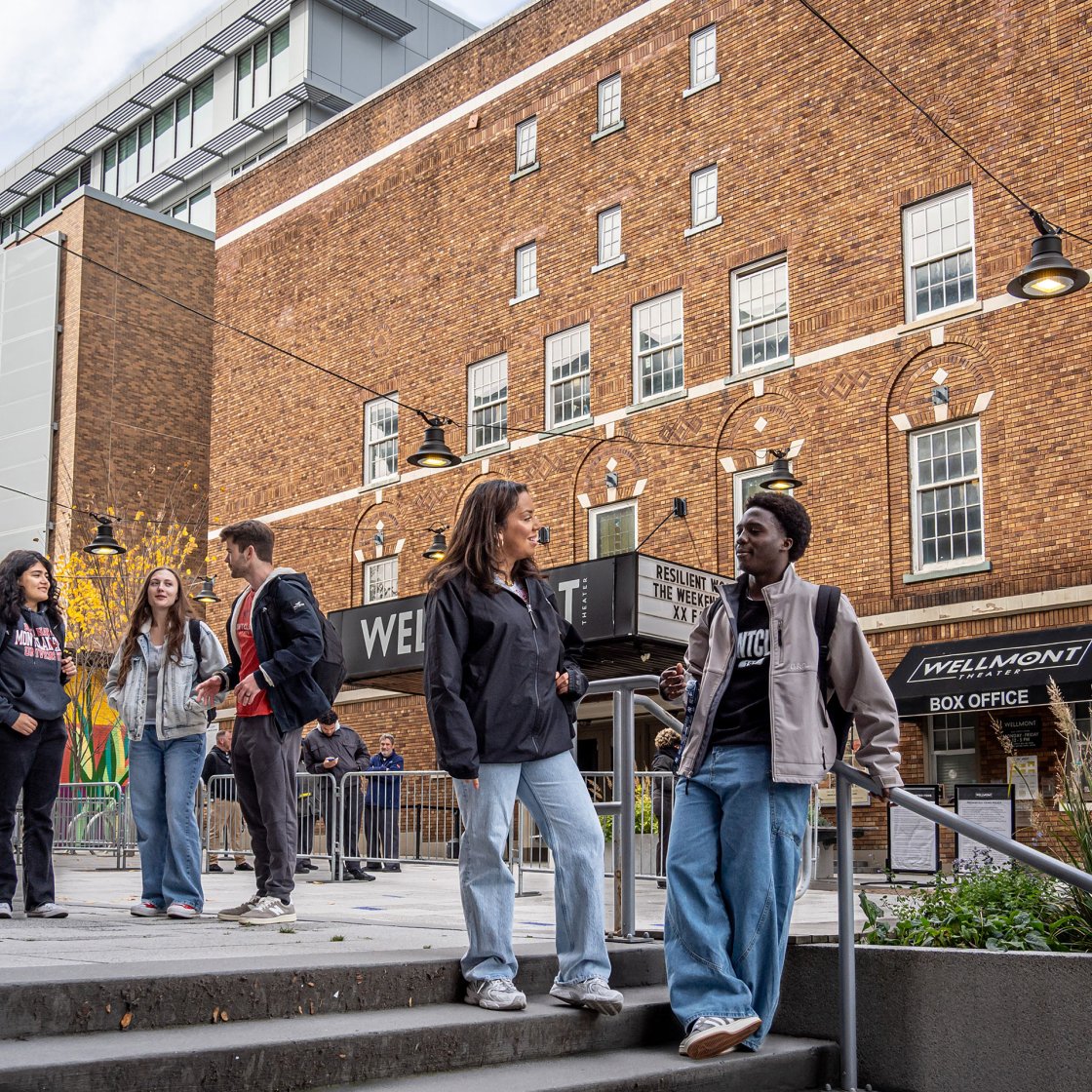 students downtown in front of the Wellmont Theater