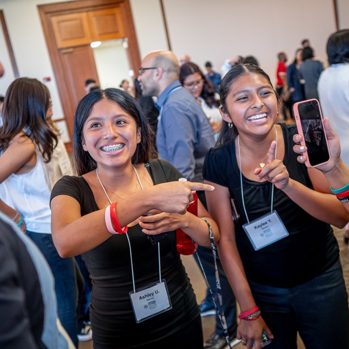 Members of HSCI at Networking Event conversing with others.