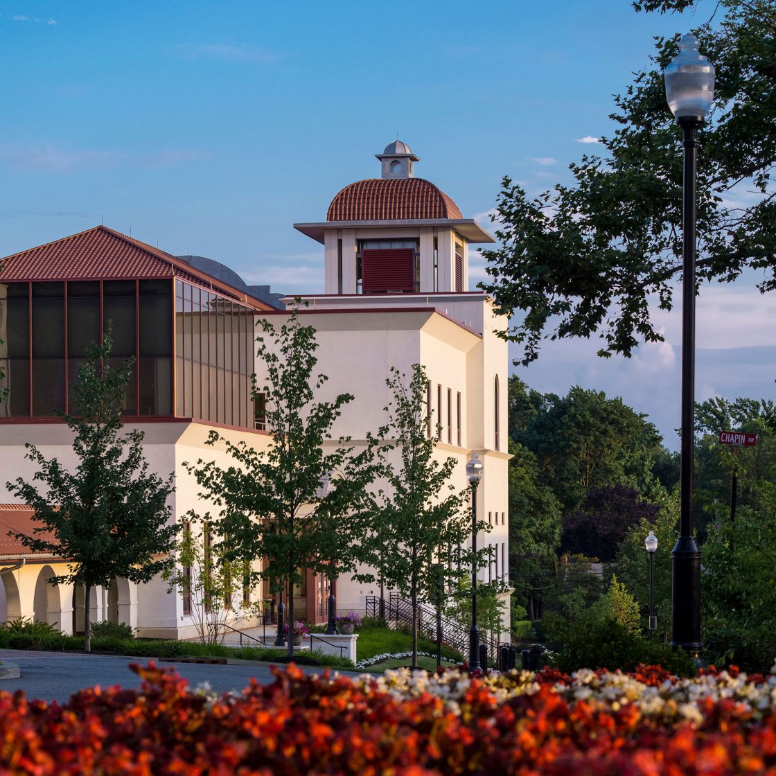 Exterior view of Chapin Hall with red plants in the foreground