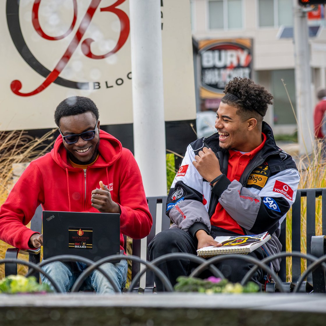 two students on a bench on bloomfield campus