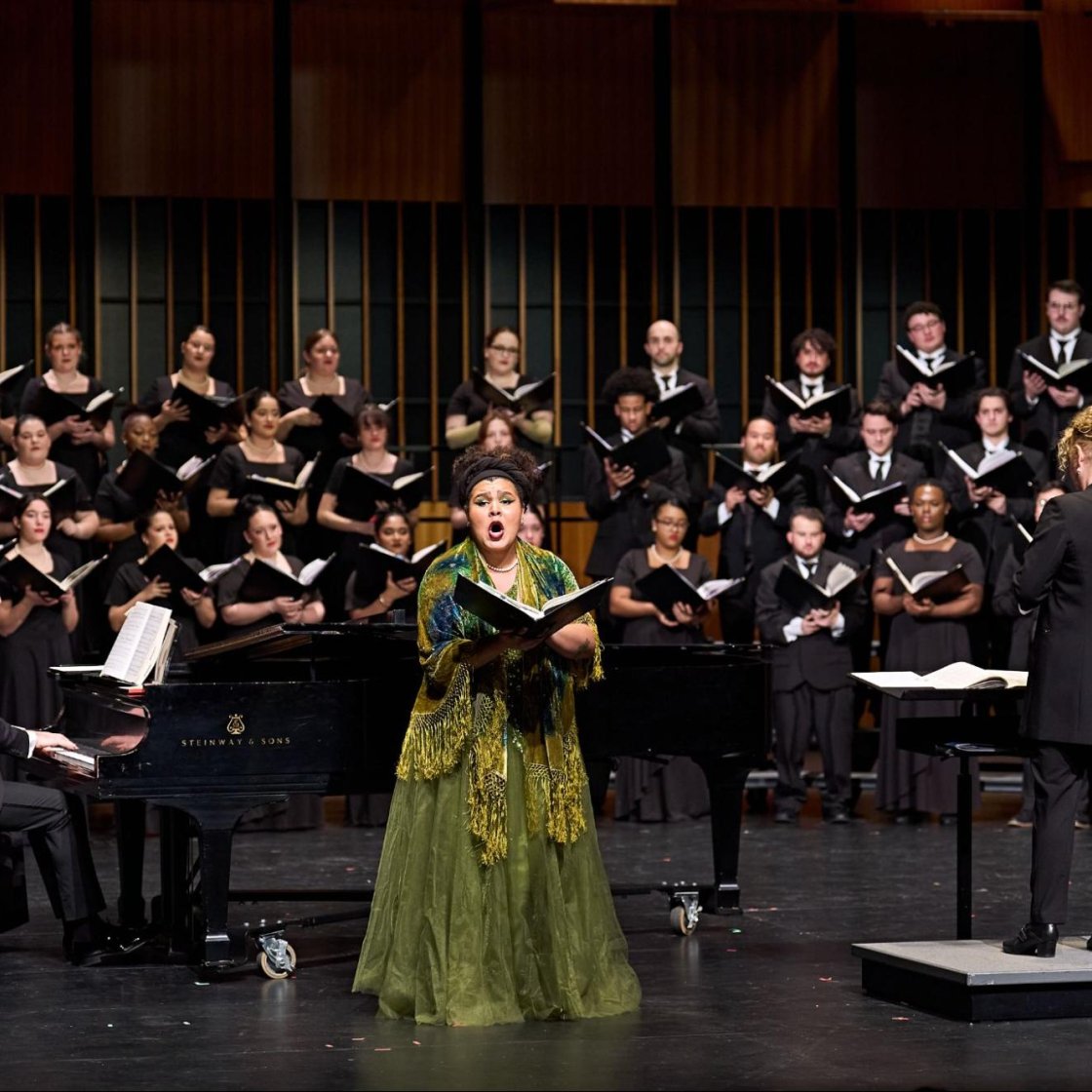 Voice performer on stage with University Chorus