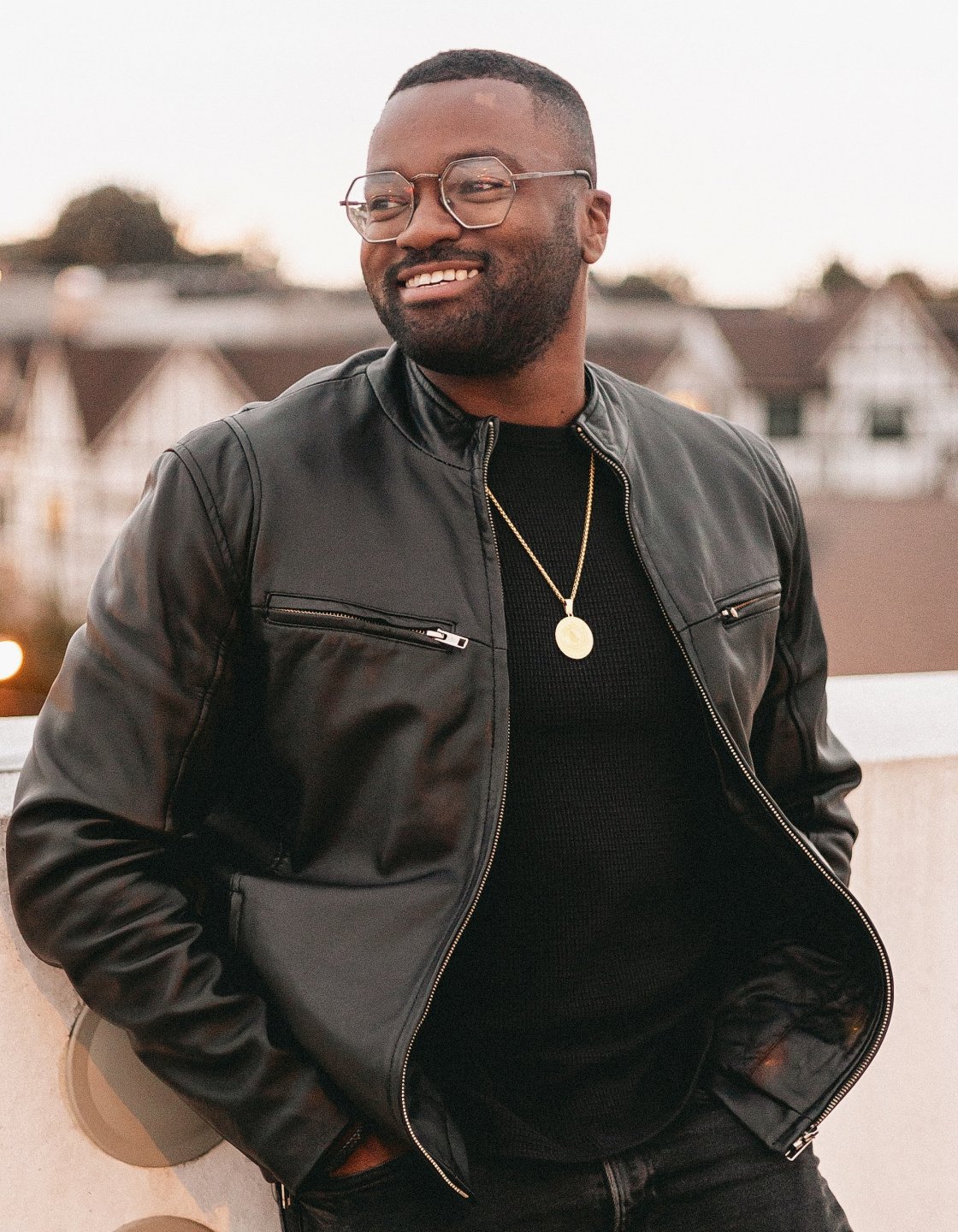 Kwami Ngaojia smiling and looking to his right