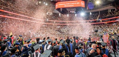 confetti falling over a crowd of graduates at Prudential Center