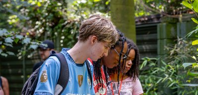 Students stand on a bridge during a Pre-College Summer Program outing.
