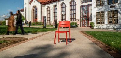 An empty red chair sits ready for a new incoming student at Montclair State University.