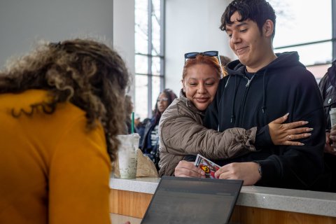 A mother hugs her son with emotion and pride during Montclair State University’s Accepted Student Day.