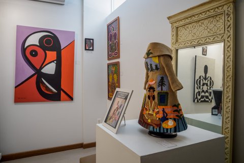 Gallery is shown with a waiting, a garment with pictured sewn and a picture frame. 