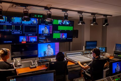 Three high school students watch television monitors, gaining hands-on experience at Montclair’s state-of-the-art School of Communication and Media.