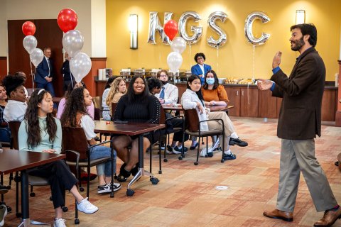 Koppell speaking to room full of students