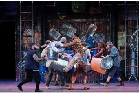 Isaiah Robinson and fellow cast members onstage in “Stomp!”