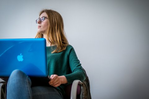 Student Sitting with Computer on Lap