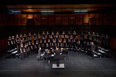 Chorale on stage with Dr. Buchanan and Accompanist