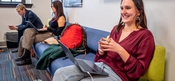 A student sits at a computer on the campus of Montclair State University.