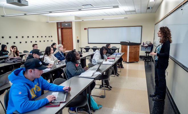 Instructor addressing classroom of students